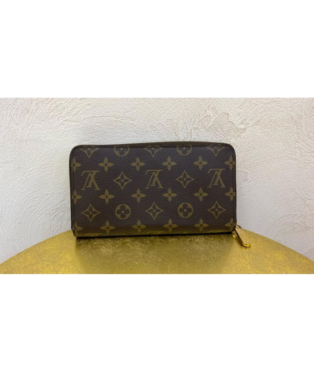 LOUIS VUITTON PRE-OWNED Коричневый кожаный кошелек, фото 9