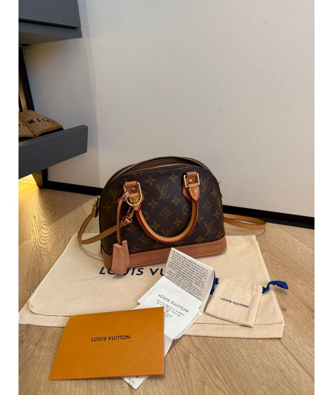 LOUIS VUITTON Коричневая кожаная сумка с короткими ручками, фото 4