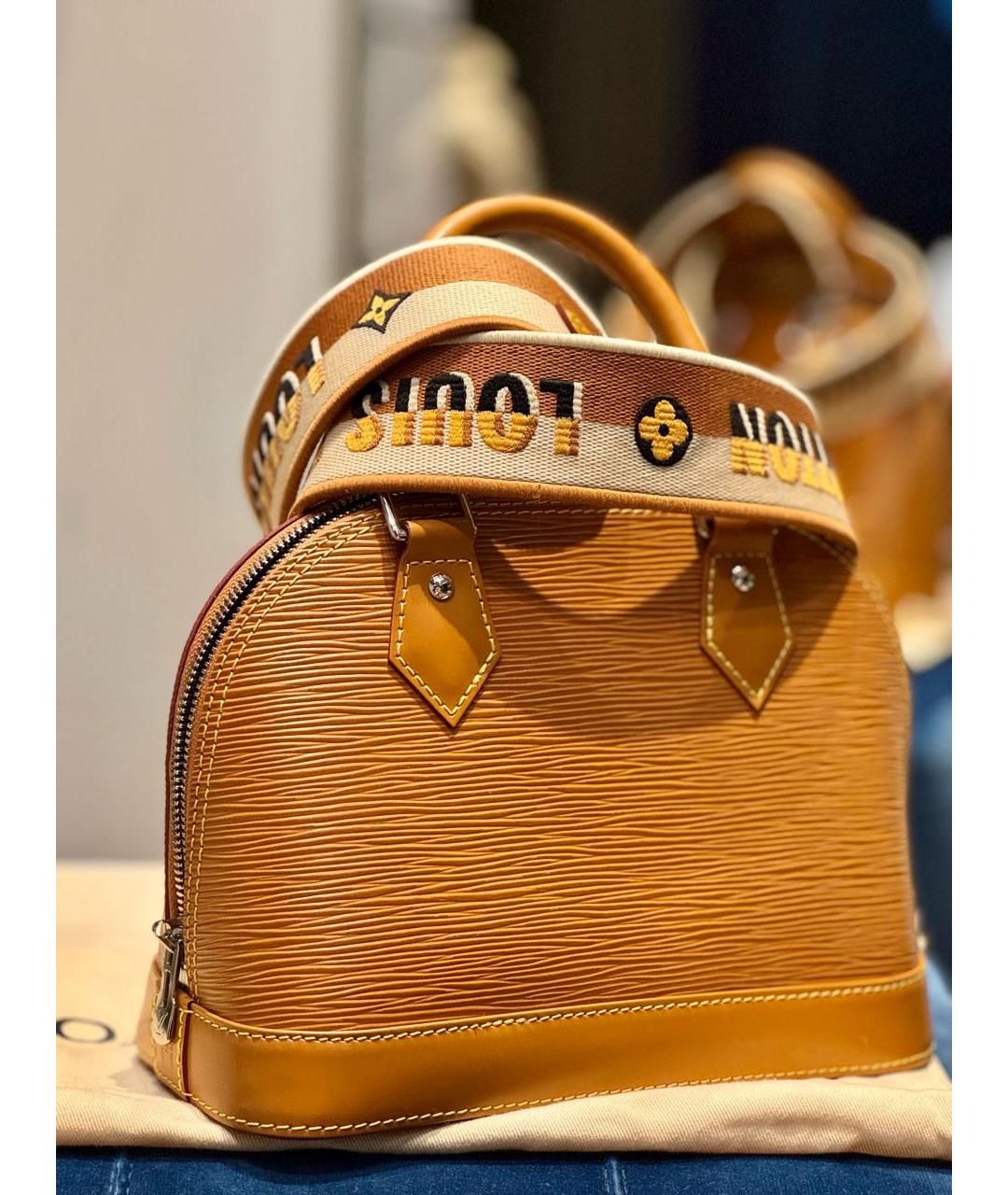 LOUIS VUITTON Горчичная кожаная сумка с короткими ручками, фото 8