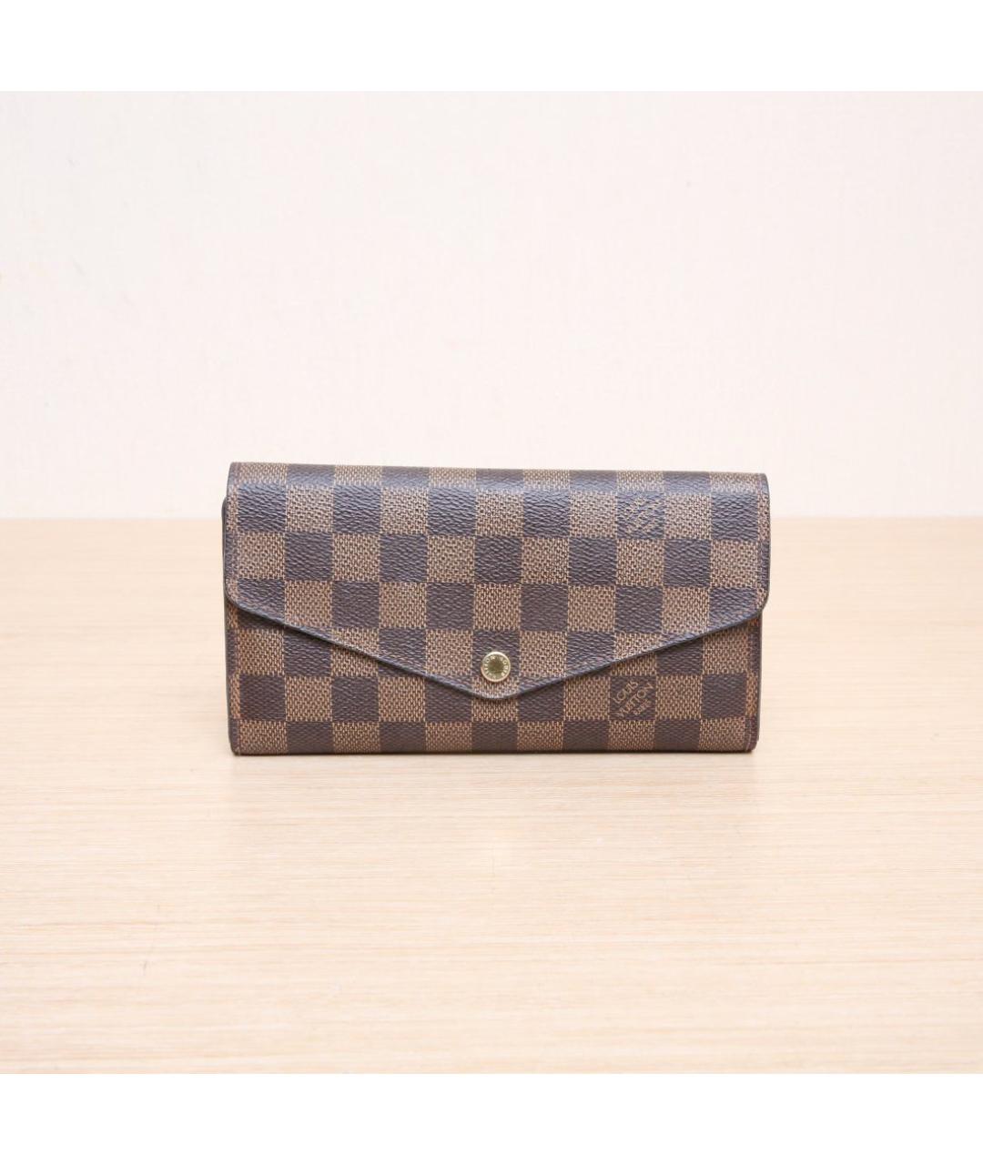 LOUIS VUITTON Коричневый кожаный кошелек, фото 3