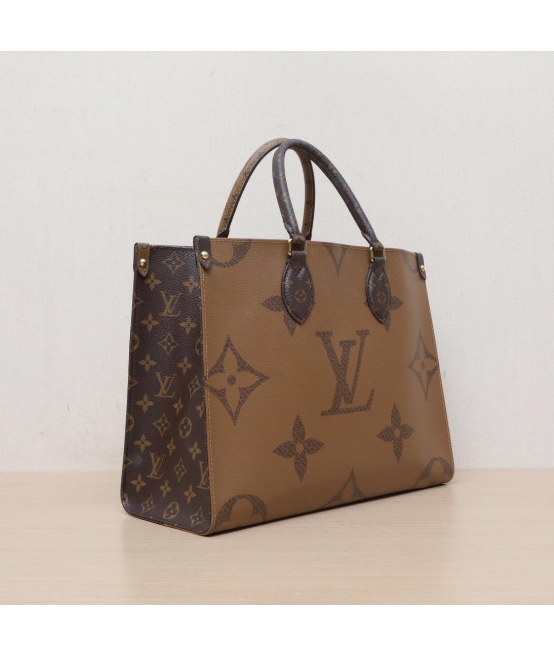 LOUIS VUITTON Коричневая кожаная сумка с короткими ручками, фото 6