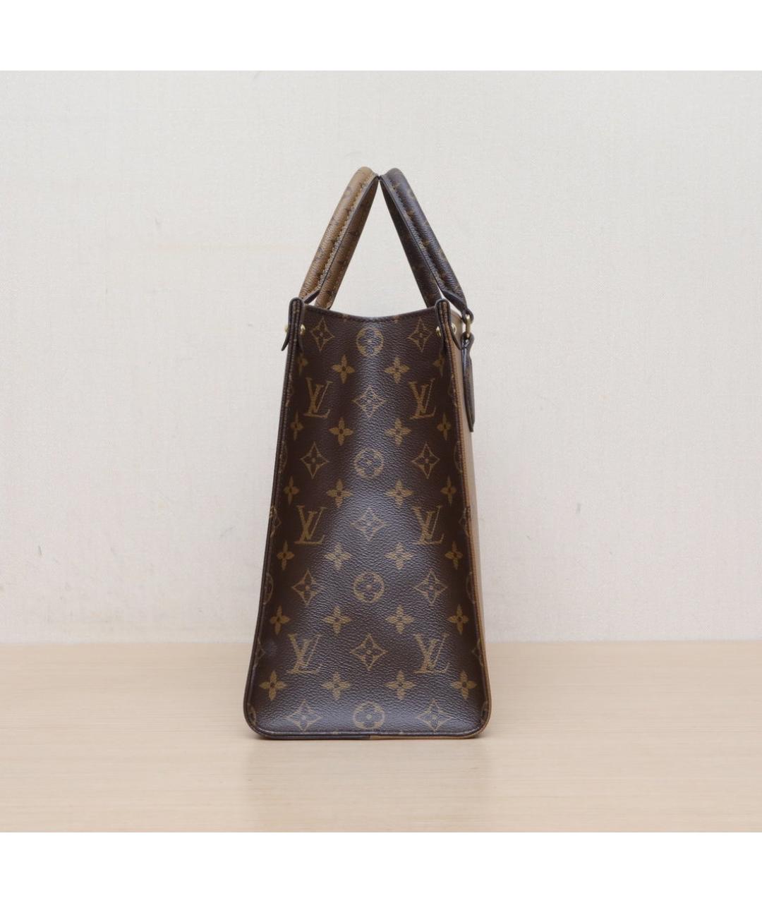 LOUIS VUITTON Коричневая кожаная сумка с короткими ручками, фото 5