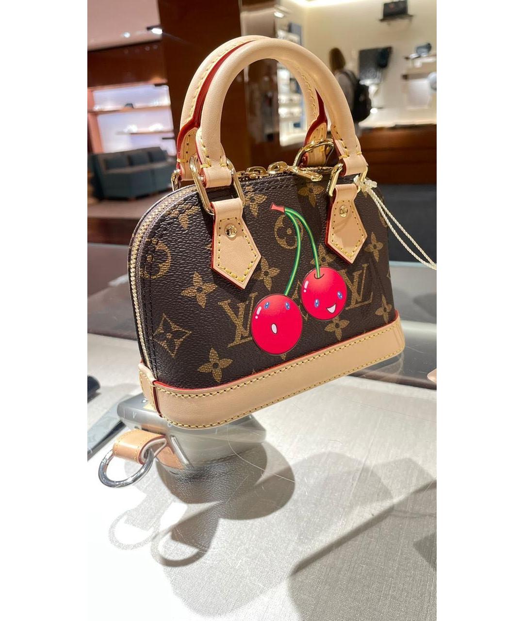 LOUIS VUITTON Коричневая кожаная сумка с короткими ручками, фото 3