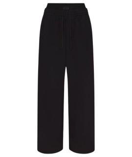 SKIMS Спортивные брюки и шорты