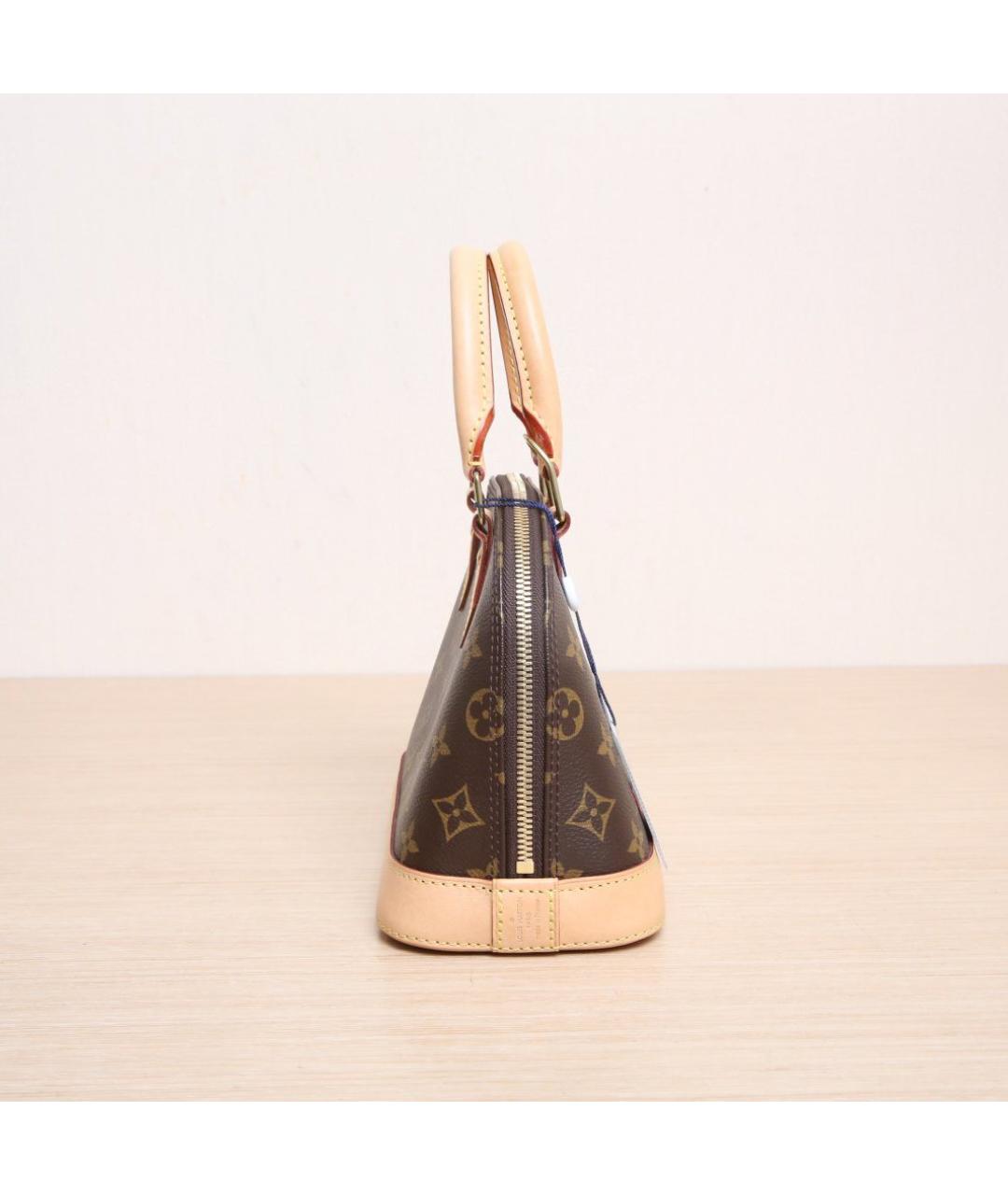 LOUIS VUITTON Коричневая кожаная сумка с короткими ручками, фото 5