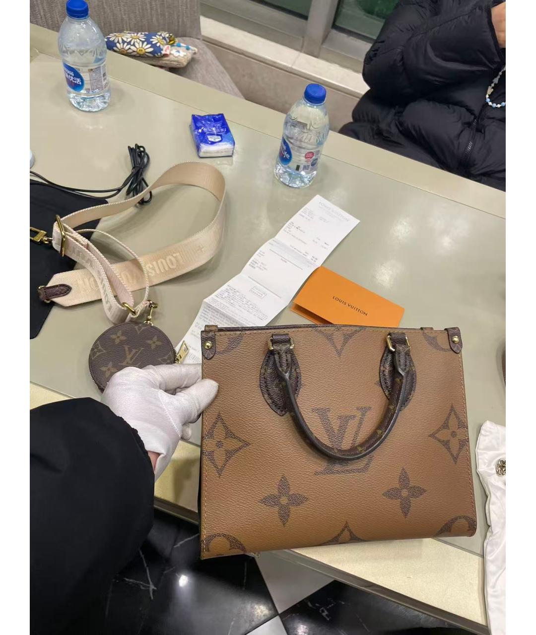 LOUIS VUITTON Коричневая кожаная сумка с короткими ручками, фото 9