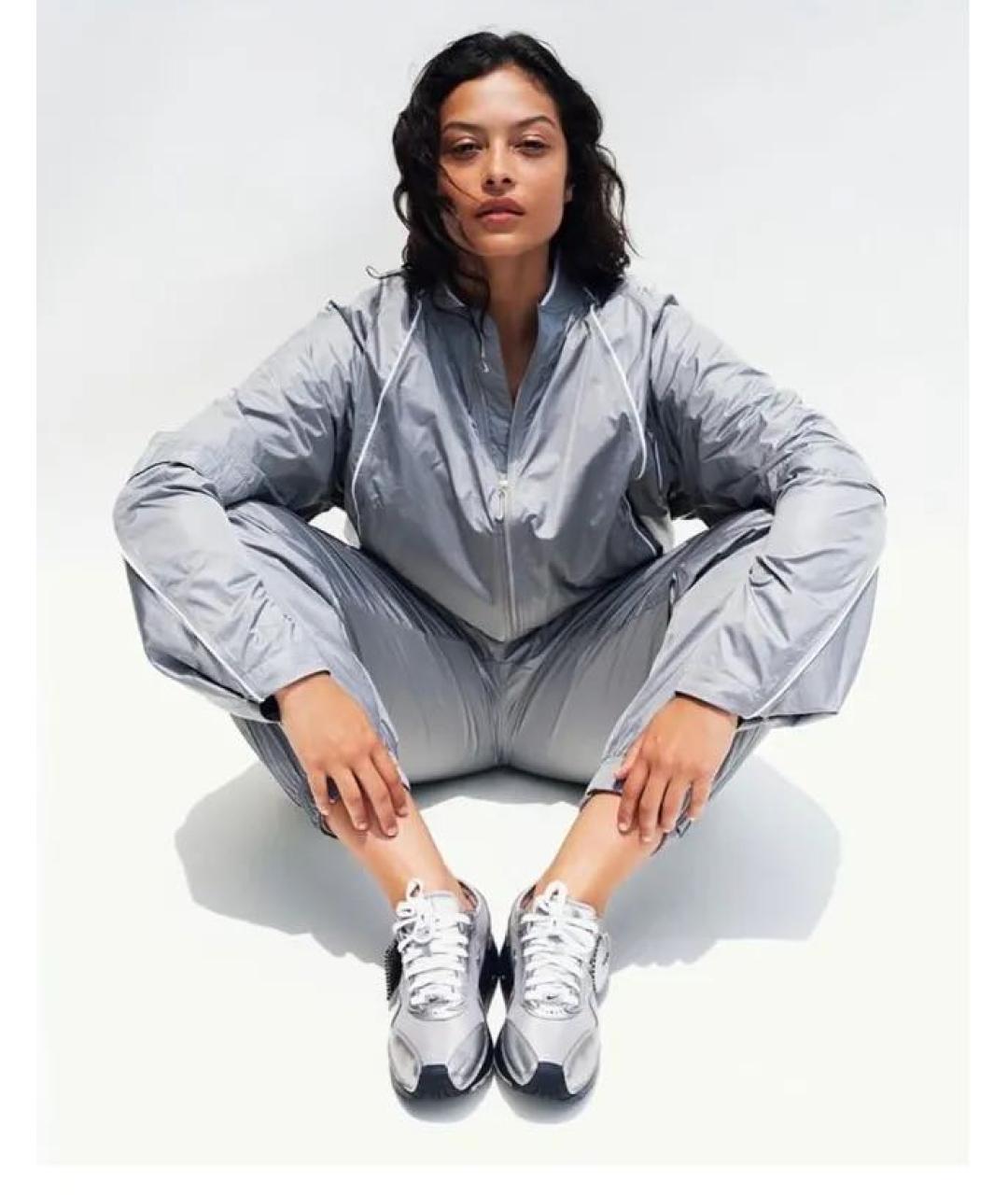 NIKE Серебряные синтетические спортивные брюки и шорты, фото 4