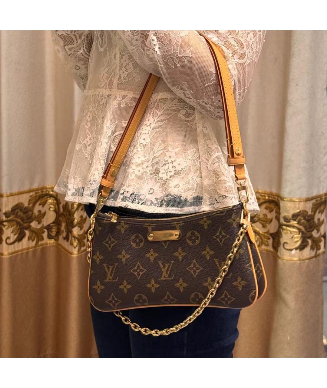 LOUIS VUITTON Коричневая кожаная сумка с короткими ручками, фото 4