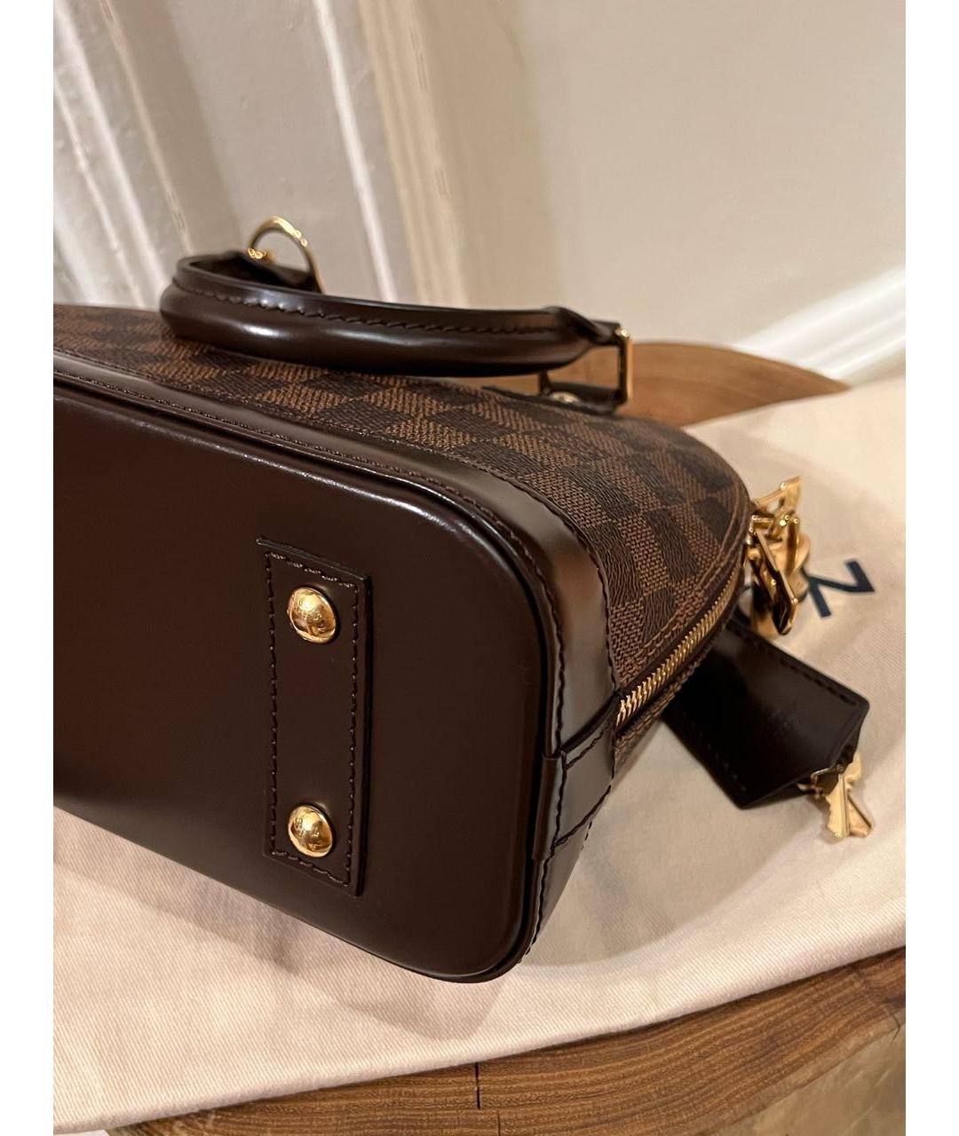 LOUIS VUITTON Коричневая кожаная сумка с короткими ручками, фото 6