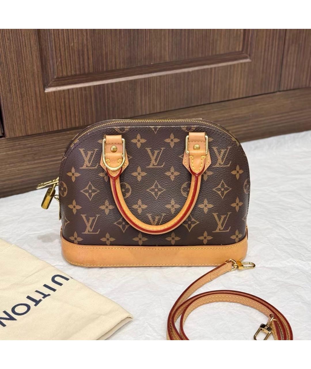 LOUIS VUITTON Коричневая кожаная сумка с короткими ручками, фото 3