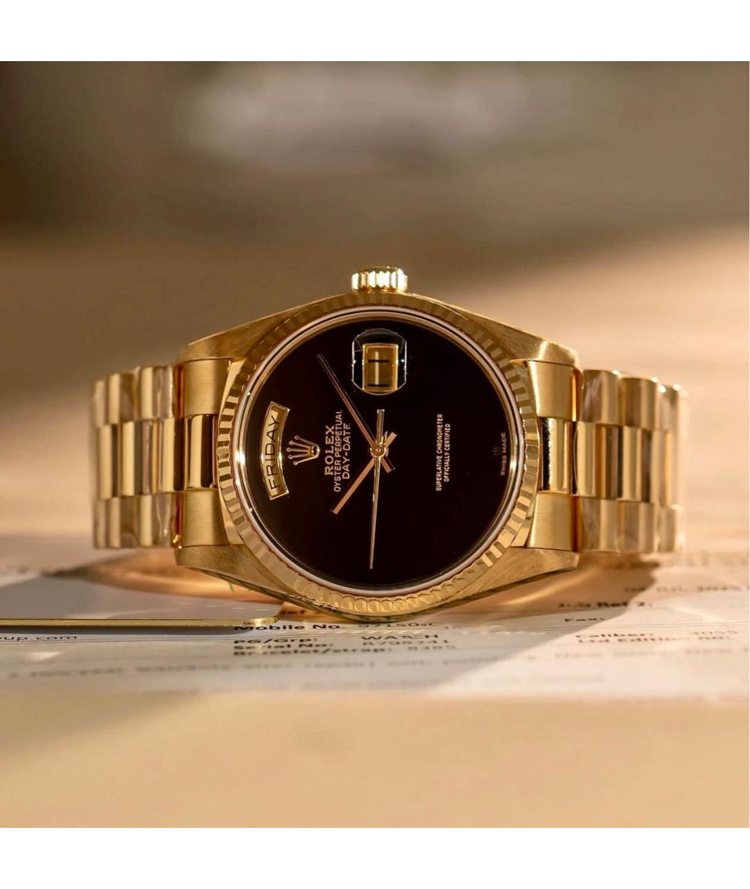 ROLEX Черные часы из желтого золота, фото 2