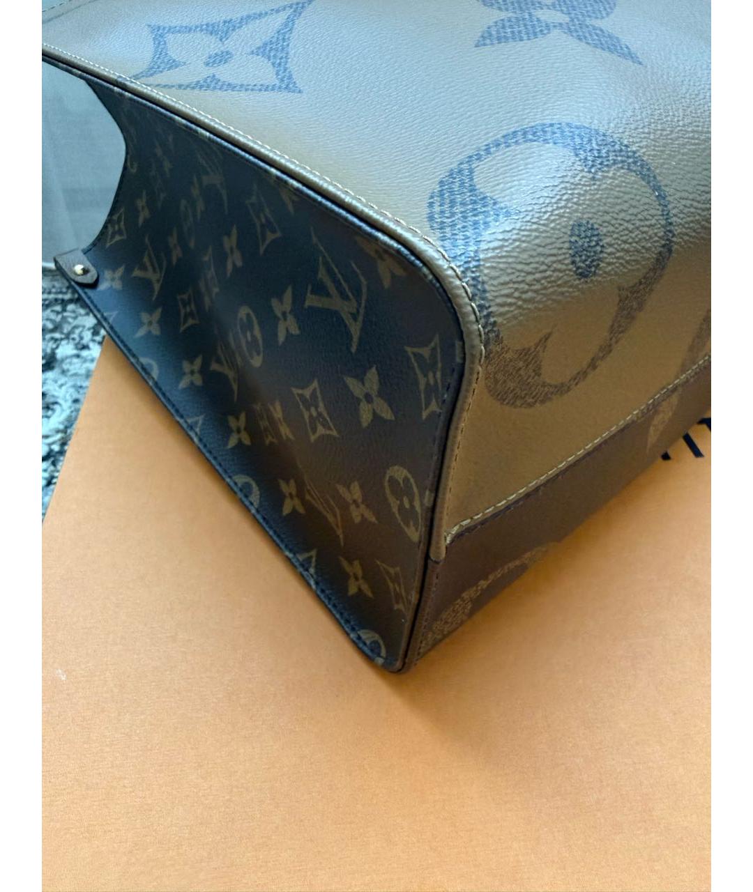 LOUIS VUITTON Коричневая кожаная сумка с короткими ручками, фото 6