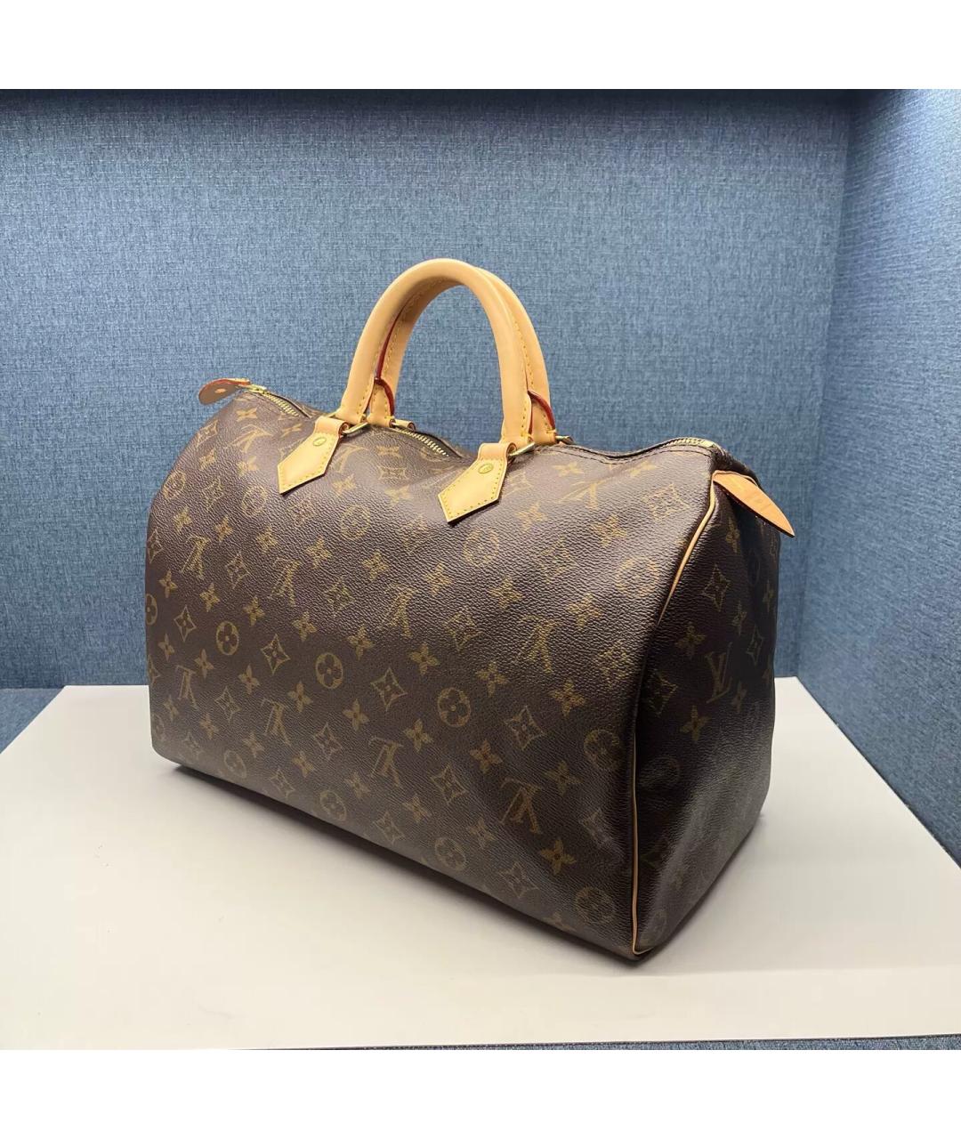 LOUIS VUITTON Коричневая кожаная сумка с короткими ручками, фото 3