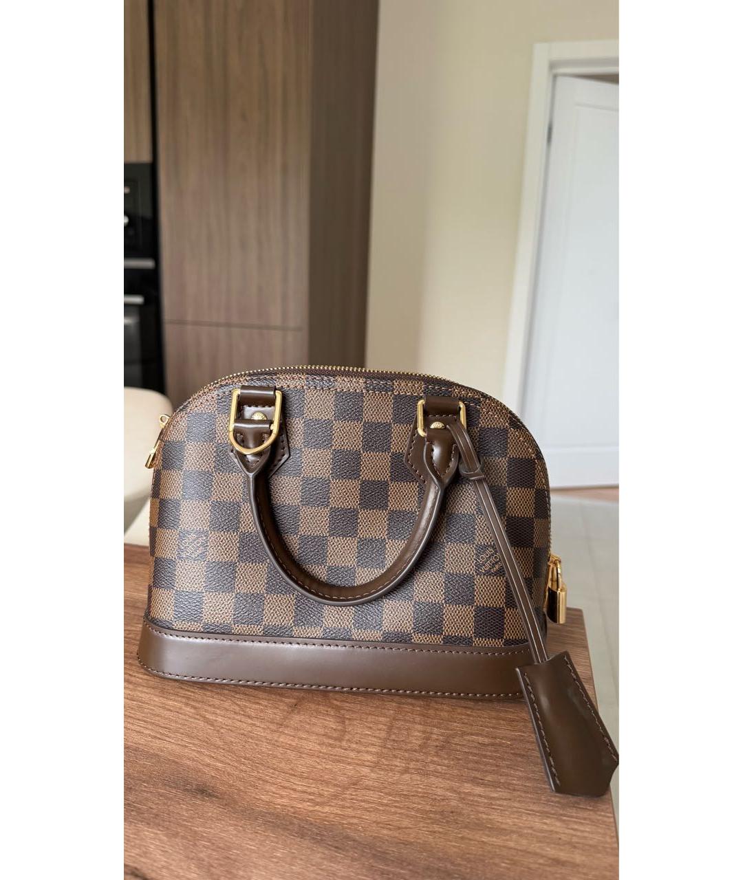 LOUIS VUITTON Коричневая кожаная сумка с короткими ручками, фото 5