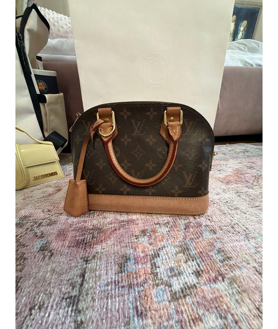 LOUIS VUITTON Коричневая кожаная сумка с короткими ручками, фото 4